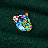 Detaljefoto af Teddy Copenhagen badge på Milton polo dark green