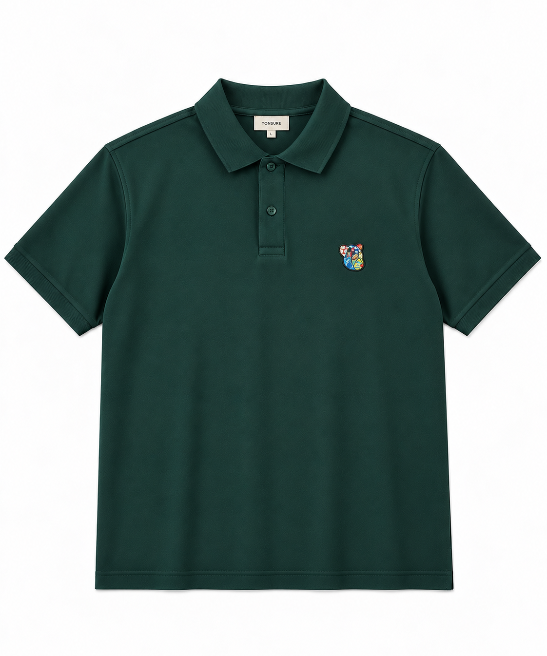TONSURE Milton Polo dark green i 100% økologisk bomuld med Copenhagen Teddy badge