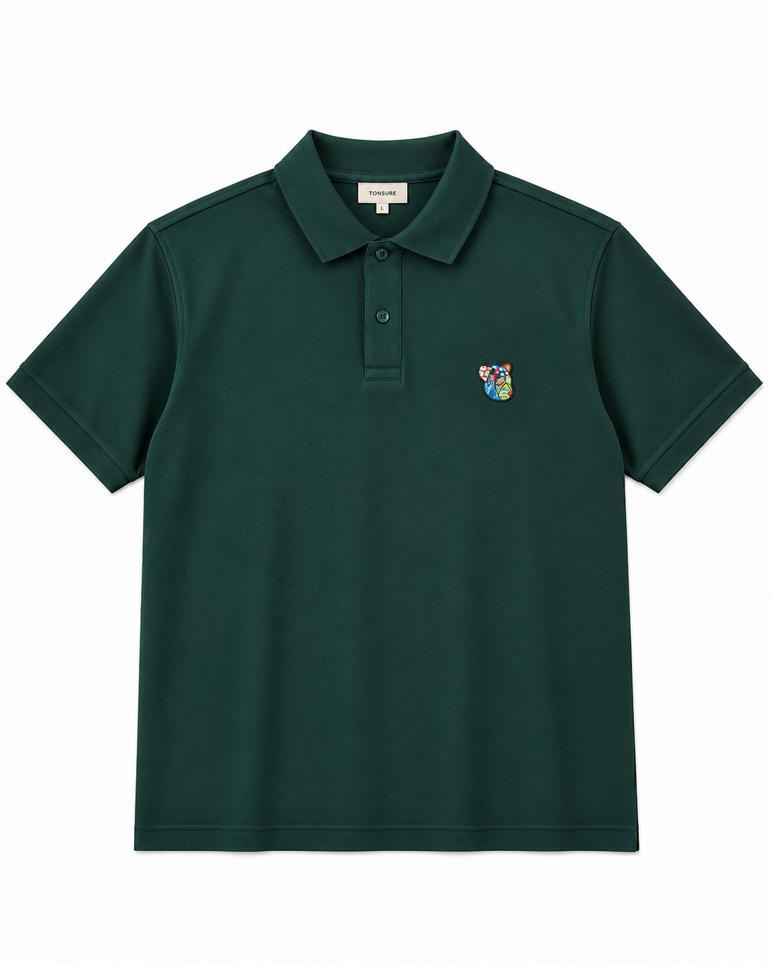 TONSURE Milton Polo dark green i 100% økologisk bomuld med Copenhagen Teddy badge