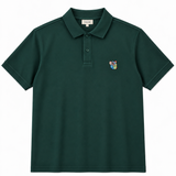 TONSURE Milton Polo dark green i 100% økologisk bomuld med Copenhagen Teddy badge