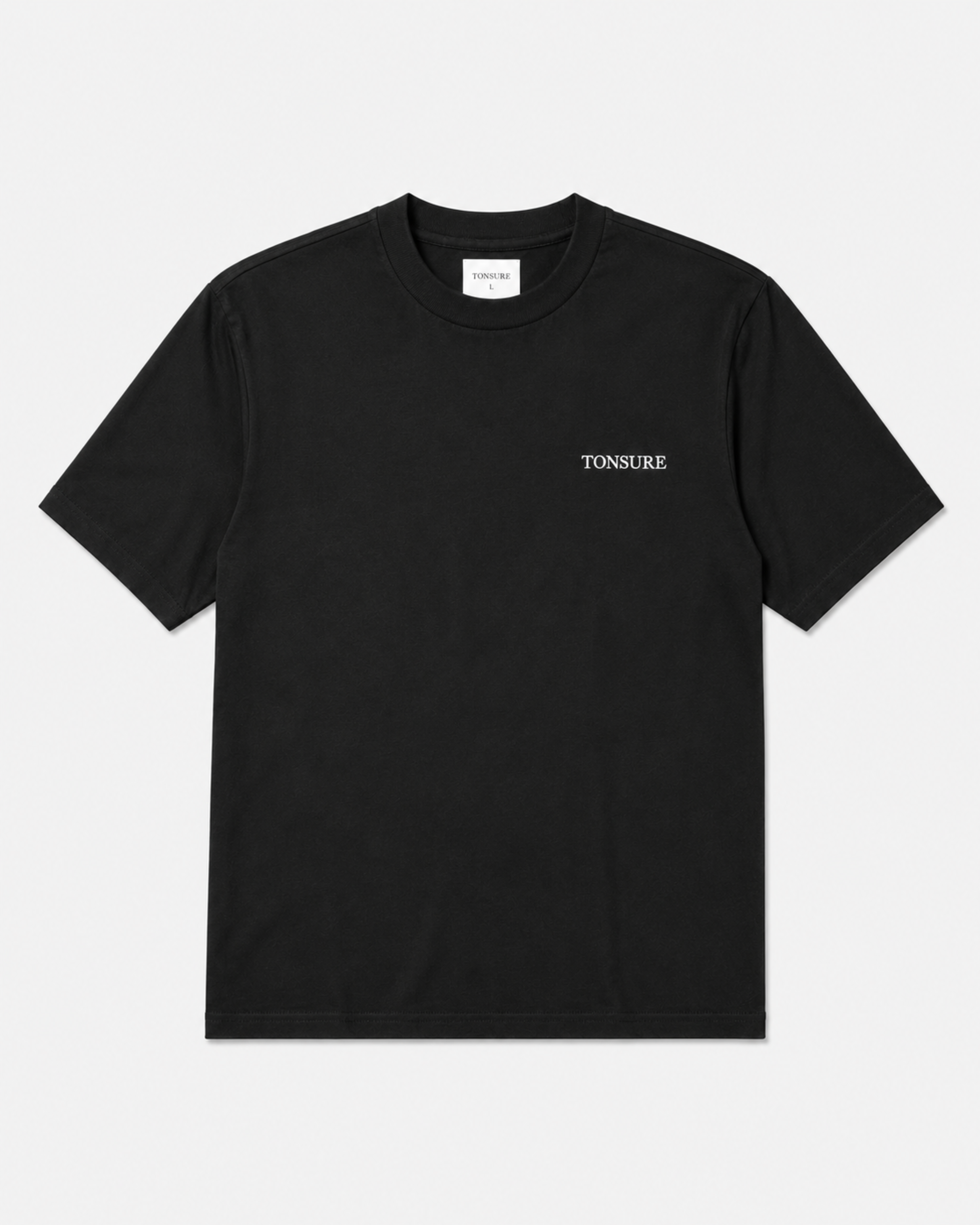 Sort t-shirt til mænd i bæredygtigt bomuld fra danske herretøjsbrand Tonsure. Ryggen er prydet med Teddy Copenhagen print i stor størrelse.